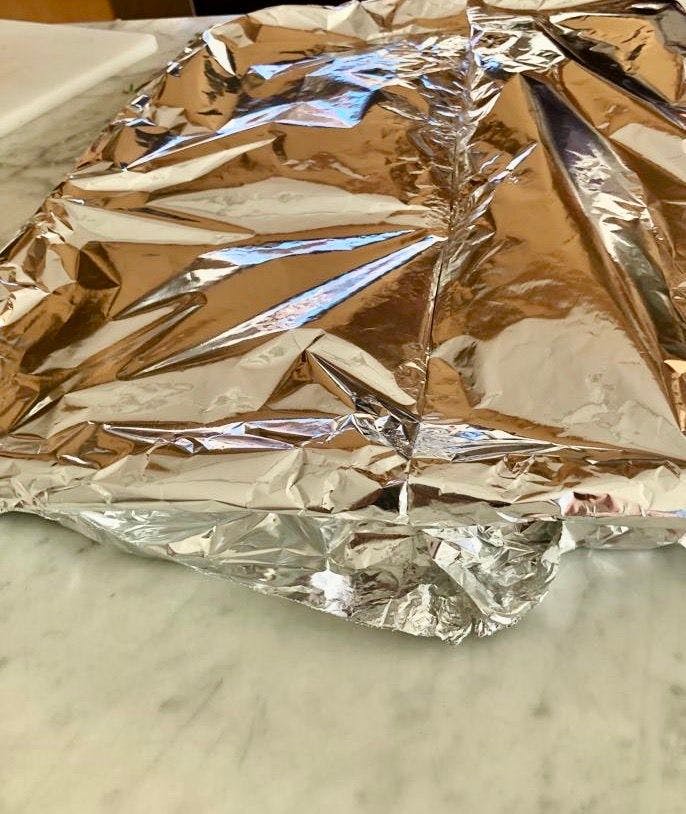 oven tray covered with silver foil