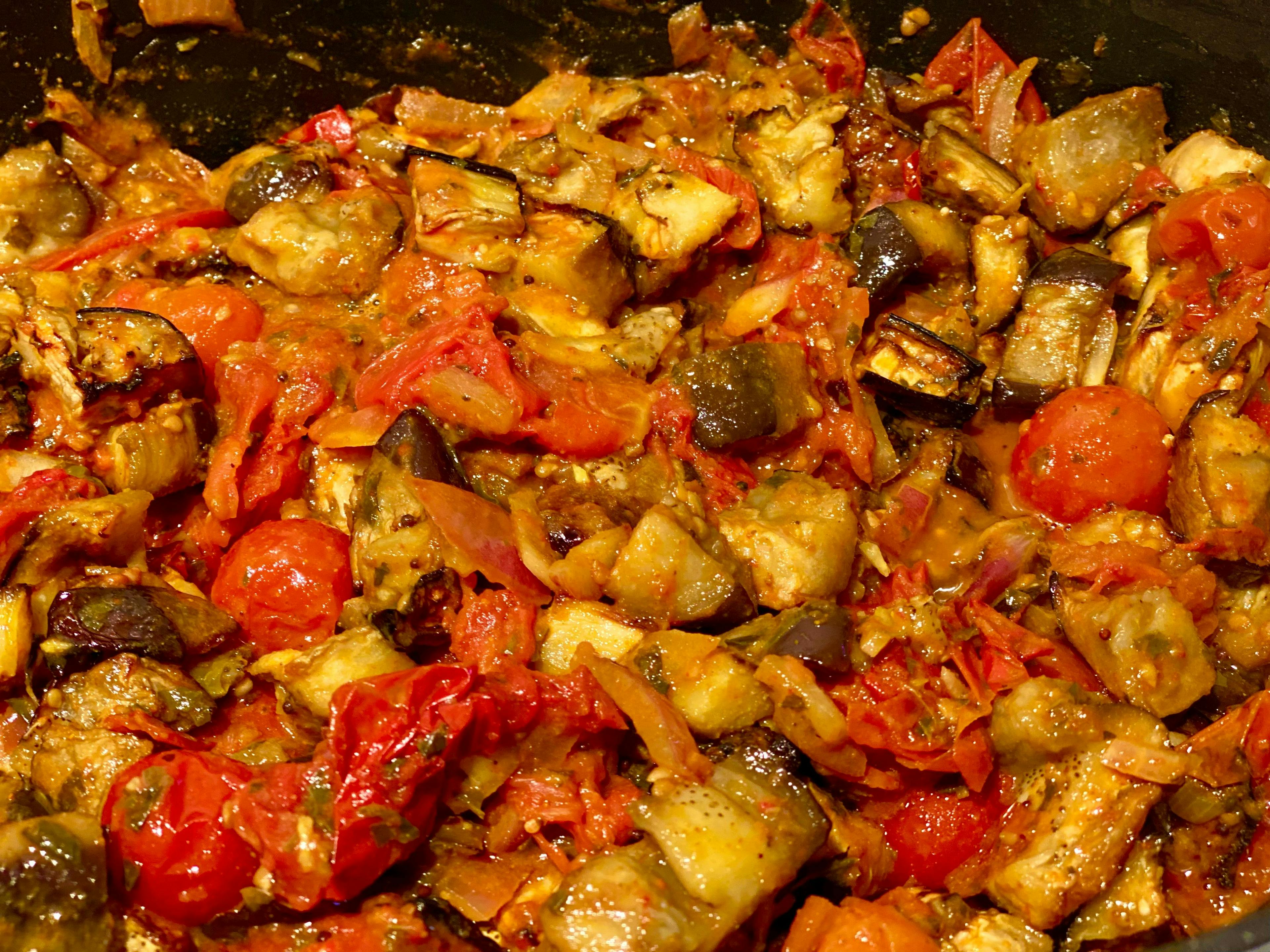 aubergines, tomatoes and onion mix gently stirred together