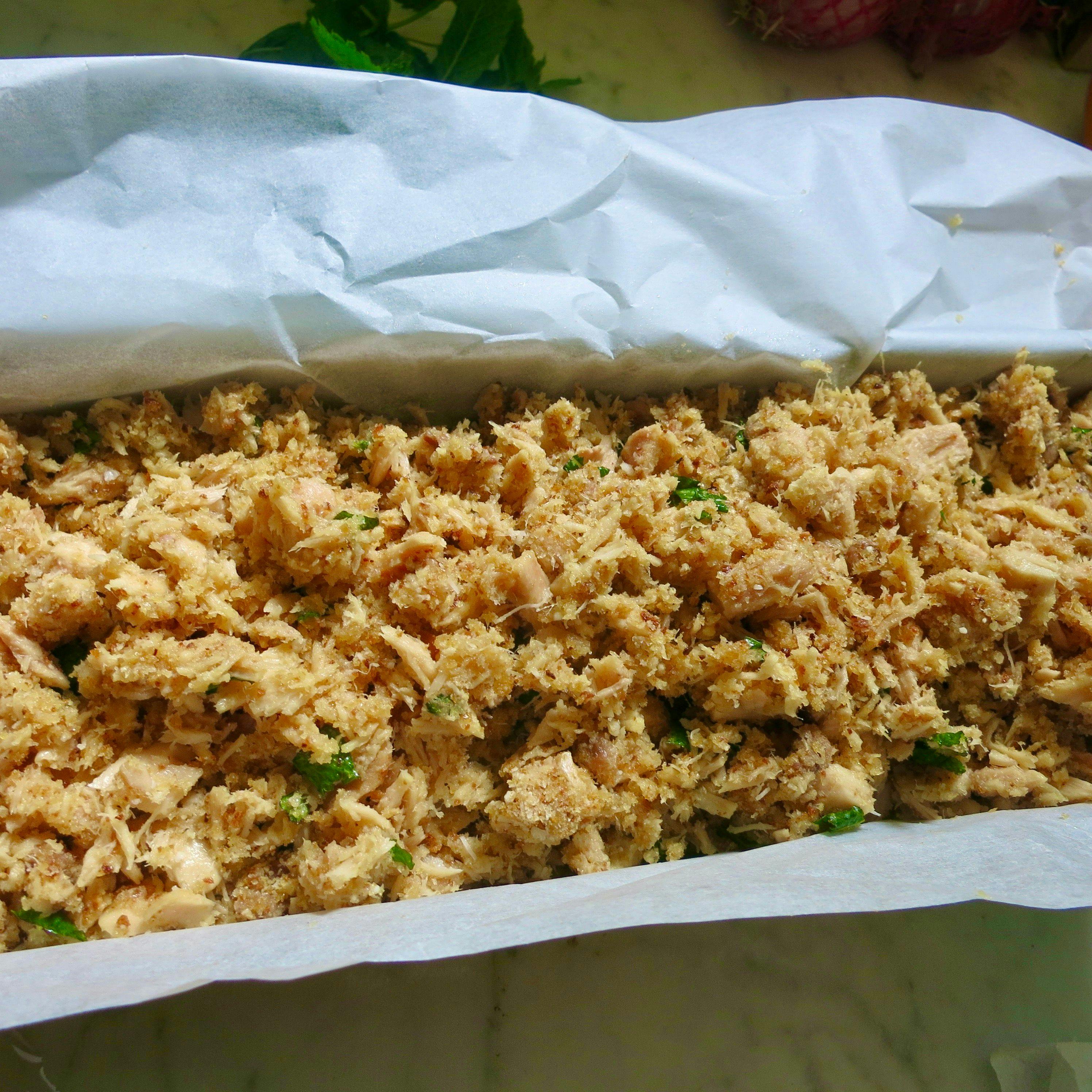 lined baking tin with tuna filling