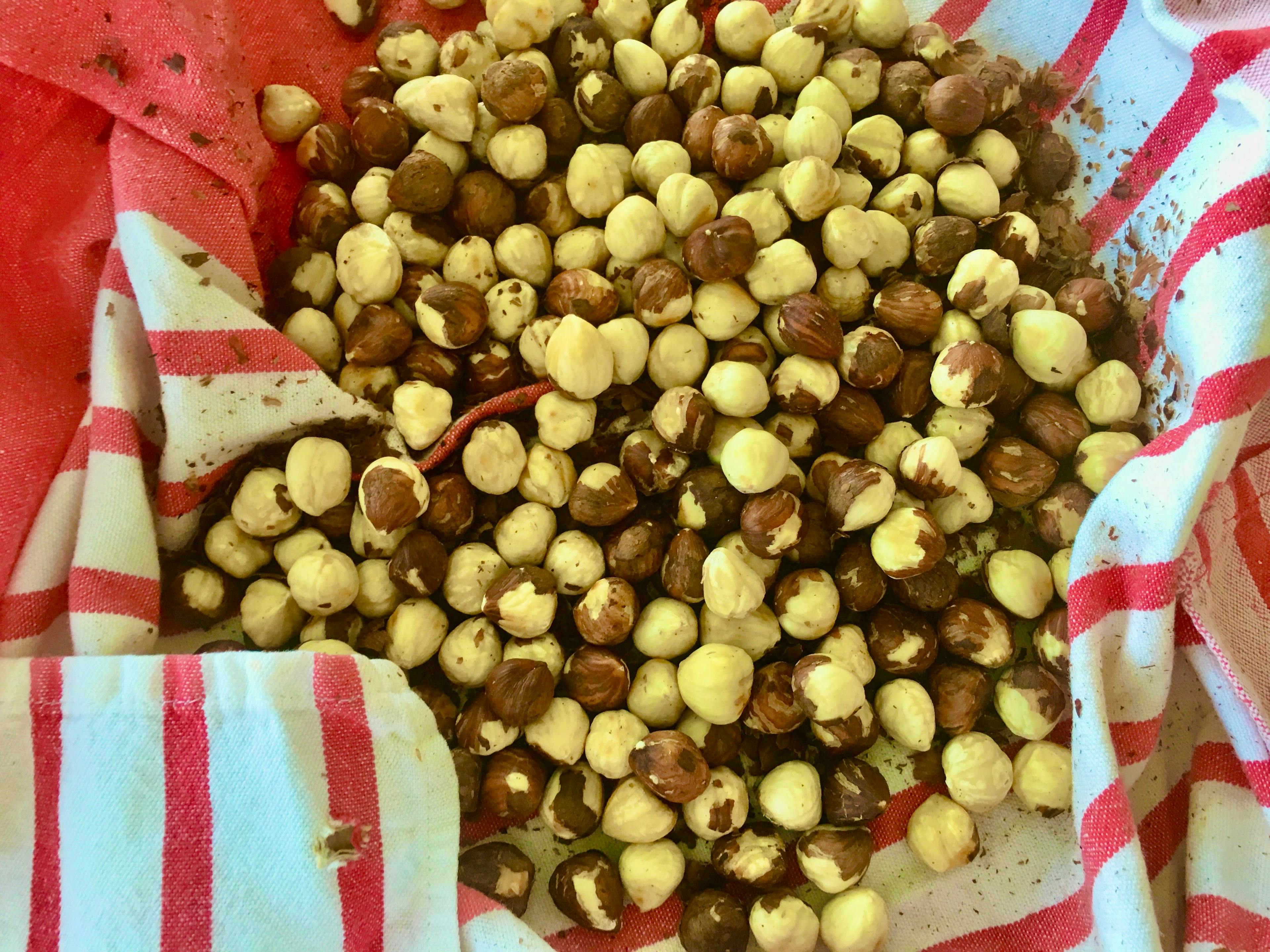 hazelnuts in a tea towel with skin rubbed off