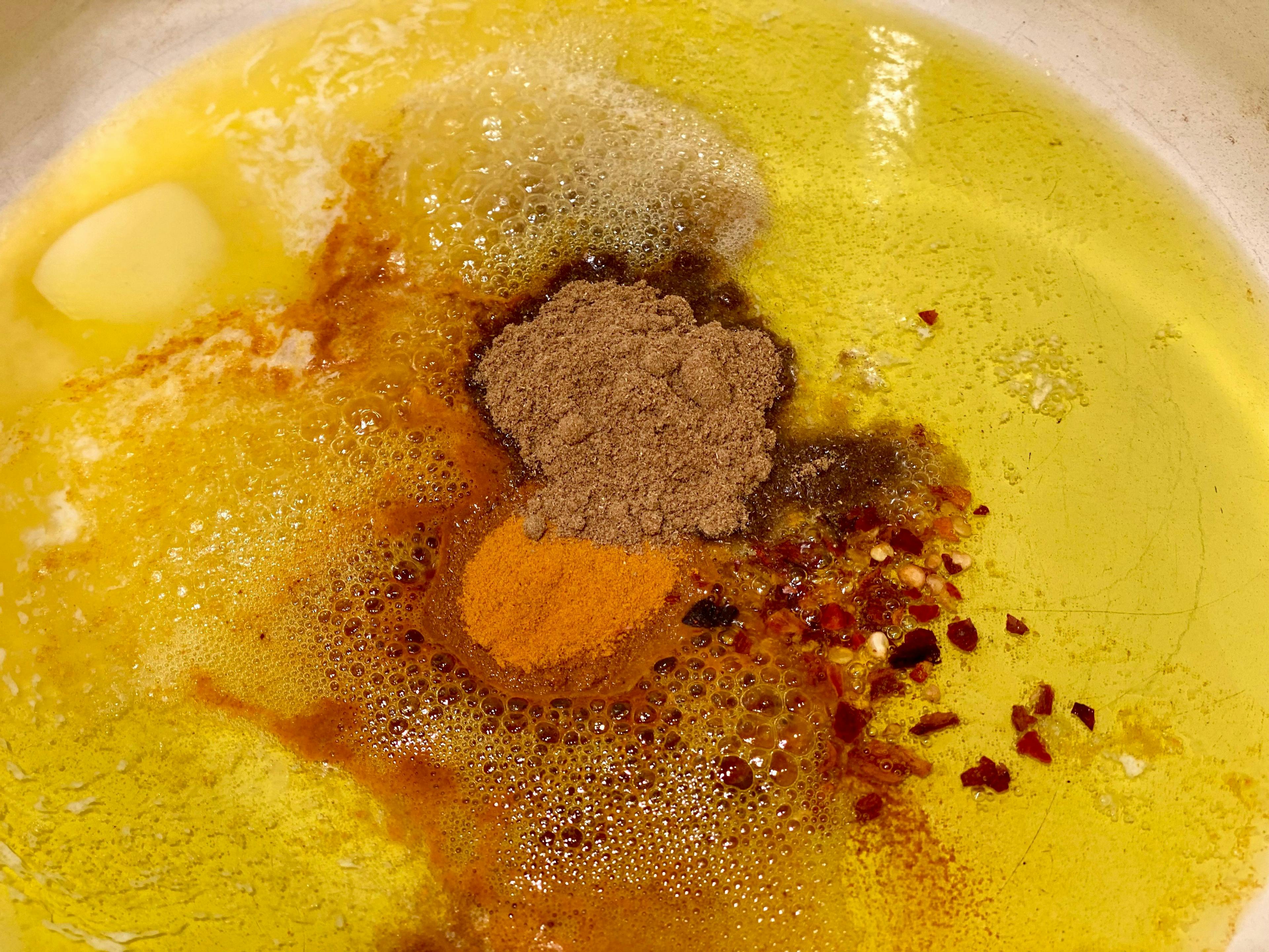 spices frying in a little butter and oil