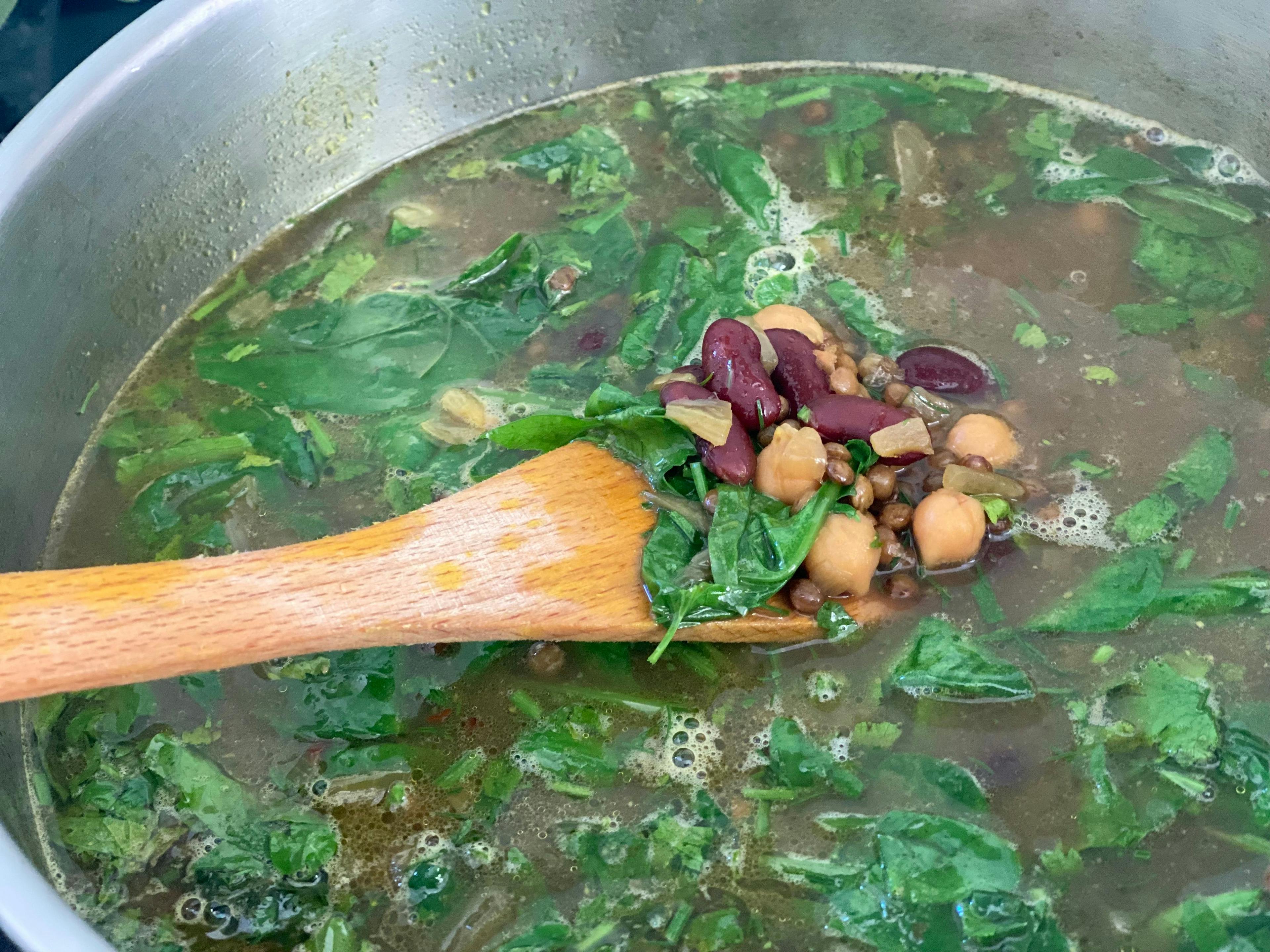 pot of soup with pulses and greens