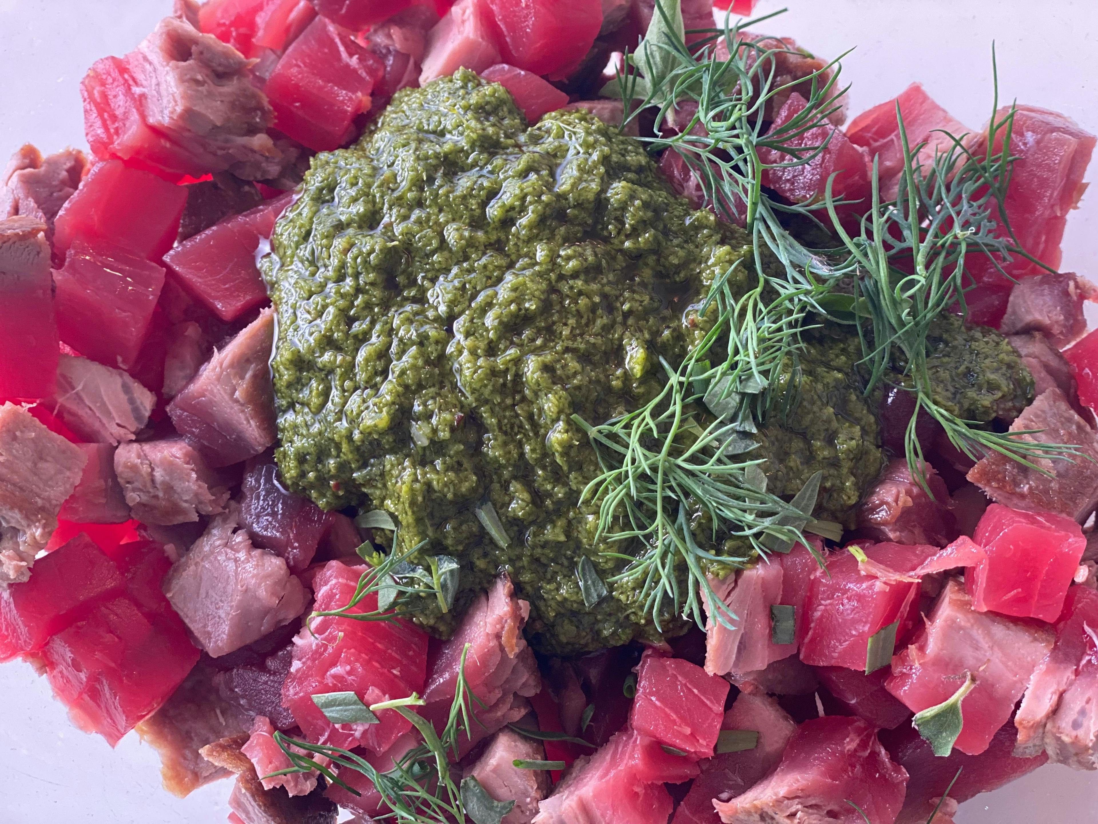 diced tuna with green sauce on top